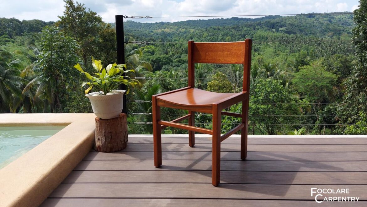 Bring timeless style and comfort into your home with the Focolare Prototype chair. This chair is constructed from solid mahogany wood with natural finish, and features a bent seat with smooth curves for added comfort. - Focolare Carpentry - High Quality Furniture Philippines